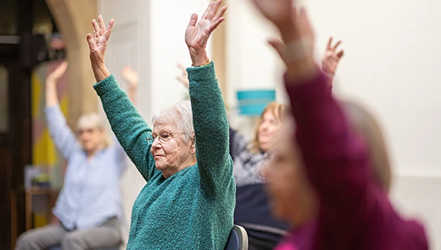 senior woman in an exercise class